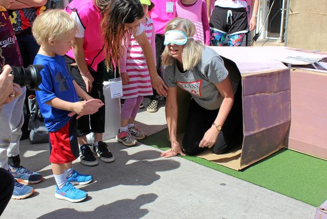 Janine Bok coming out of the pig maze for the Darth's Delinquents team at the Senior Olympics. Picture: Laura Blackmore
