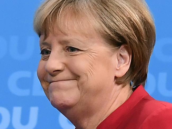 German Chancellor Angela Merkel arrives to address a press conference at the Christian Democratic Union (CDU) party headquarters in Berlin, on November 20, 2016. German Chancellor Angela Merkel told her party earlier in the day she will seek re-election next year, a move likely to be welcomed in many capitals as a sign of stability following poll triumphs for Brexit and Donald Trump. / AFP PHOTO / TOBIAS SCHWARZ / ALTERNATIVE CROP