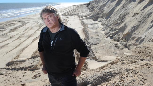 SANDS OF TIME: Coastal ecologist Ian Dyson at West Beach where the embankment has been severely eroded after recent storms. Picture: MICHAEL MARSCHALL.