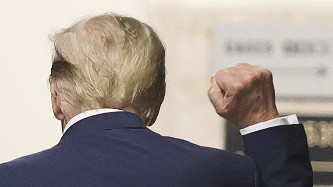 Mr Trump gestures in the hallway outside the courtroom during a recess in his trial. Picture: AFP