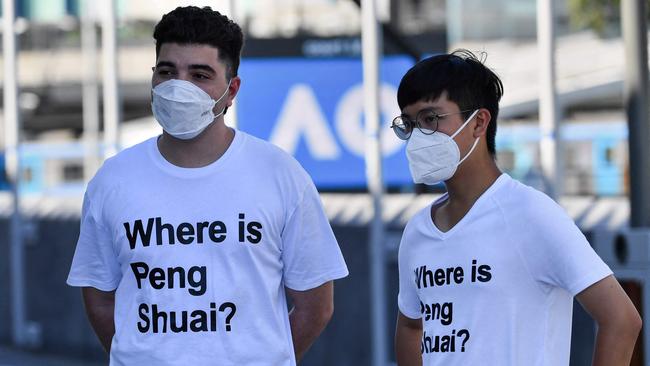 Australian human rights campaigner Drew Pavlou (left) wears a “Where is Peng Shuai?” t-shirt at the Australian Open in January. Picture: AFP