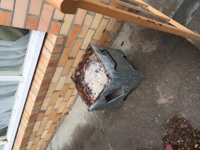 A charcoal burner seen outside the Hobart home. Picture: Matthew Denholm.