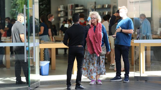 People queue to enter the Apple Store in Bondi Junction in Sydney's east on Friday. Picture: Britta Campion