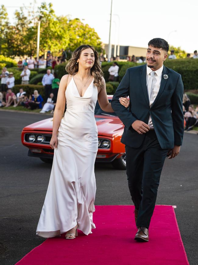 Lily Richmond and Abdullah Al-Halfi arrive at Harristown State High School formal at Highfields Cultural Centre, Friday, November 18, 2022. Picture: Kevin Farmer