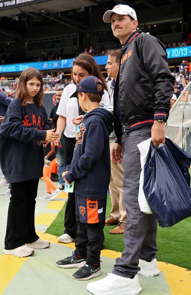 Defying any rumours of a breakup in the wake of Ashton Kutcher’s resurfaced comments about Diddy’s wild parties, the actor was spotted with wife Mila Kunis and kids at a Chicago Bears game. Picture: Michael Reaves/Getty Images