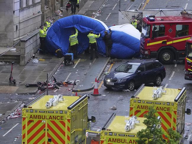 Police and emergency personnel after a car collided with pedestrians near the Liver Building. Picture: AP Photo/Jon Super