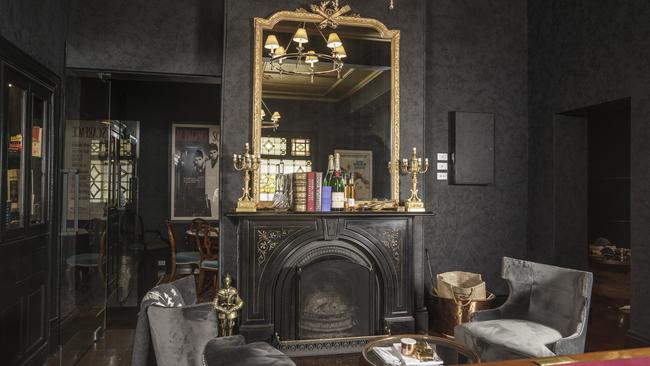 The front bar has been given a glamorous makeover with marble fireplaces and a dark, lavish decor. Picture: Nick Clayton