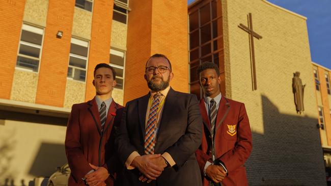 Principal of Marcellin College in Bulleen Marco DiCesare with students James and Panesh. Picture: Valeriu Campan