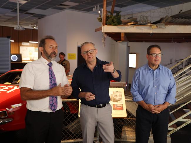 Territory historian Jared Archibald, Prime Minister Anthony Albanese and Member for Solomon Luke Gosling at the MAGNT Cyclone Tracy exhibition on December 24, 2024. Picture: Sam Lowe