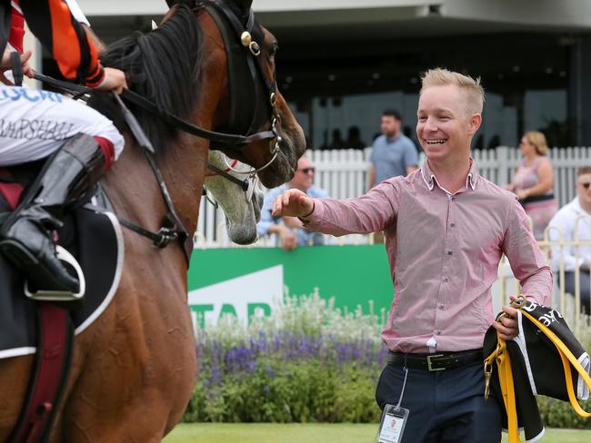 Co-trainer Will Hulbert smiles after Jockey Taylor Marshall rides Oh Five Glory to win race 1, the Mount Franklin QTIS Two-Years-Old Handicap, during the Cascade Raceday at Doomben Racecourse in Brisbane, Saturday, December 8, 2018. (AAP Image/Jono Searle)