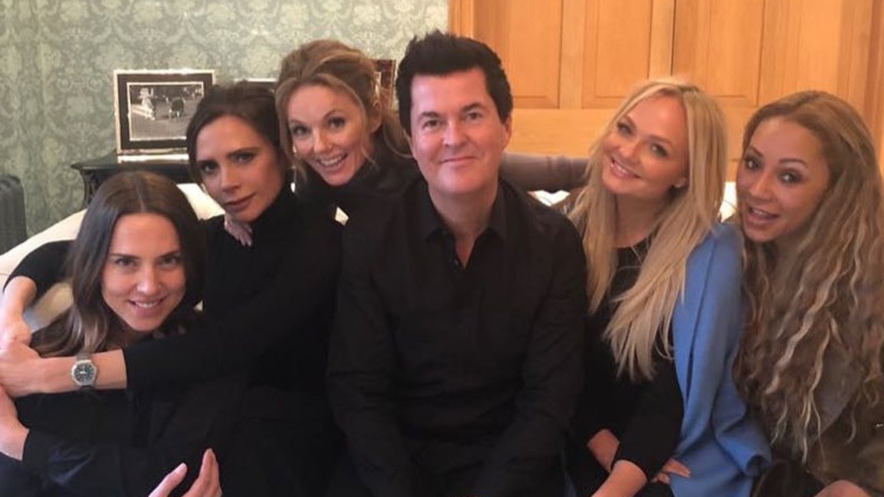 The Spice Girls with manager Simon Fuller, centre.