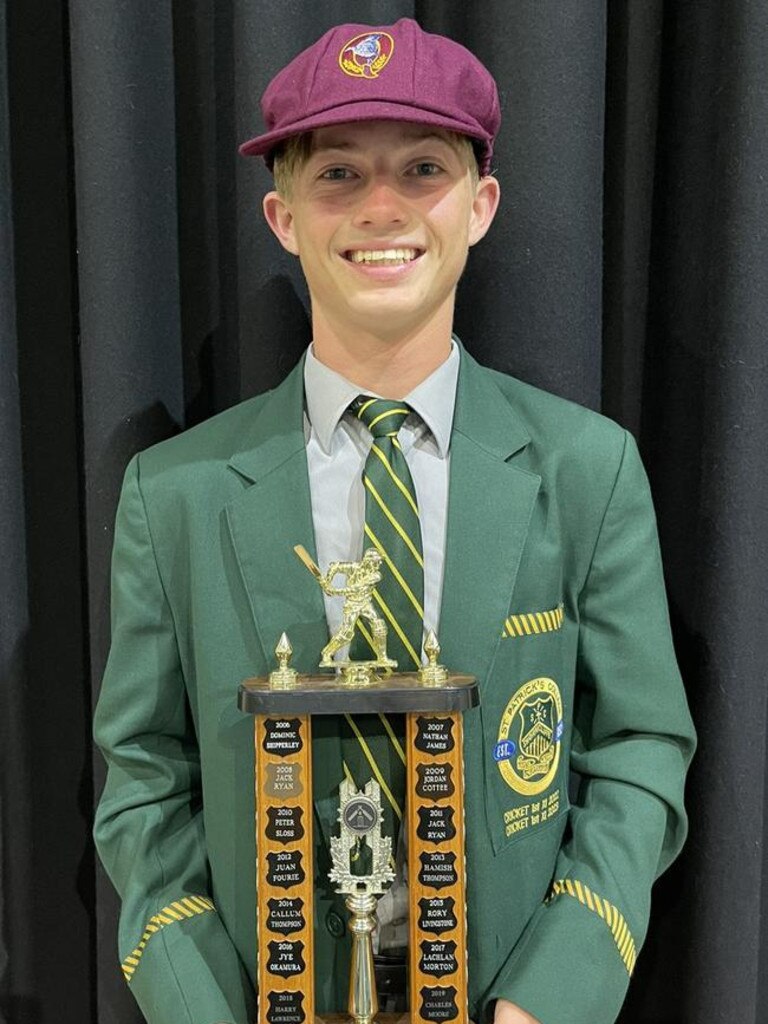 A proud as punch Steve Hogan with an award from St Patrick's College.