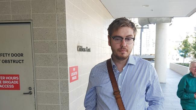 James Michael Waugh, 29, a former reporter for The Queanbeyan Age, surrendered himself to the ACT Magistrates Court on Tuesday morning. Picture: Craig Dunlop