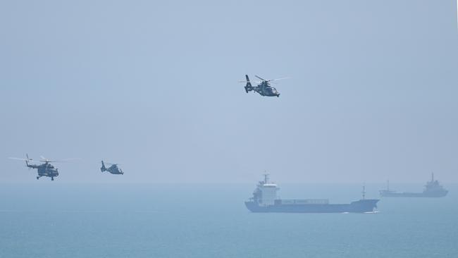 Chinese military helicopters fly past Pingtan island, one of mainland China's closest point from Taiwan. Picture: AFP