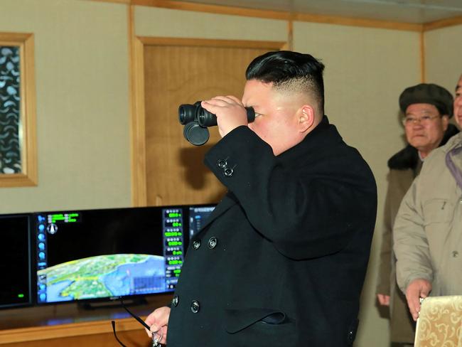 North Korean leader Kim Jong-un inspects the test-launch of a surface-to-surface medium long-range ballistic missile. Picture: AFP/KCNA via KNS