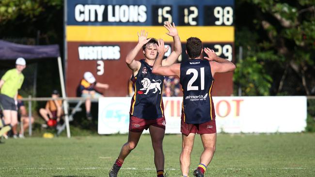 Lions' Tom Lindenmayer and Charlie O'Neill celebrate a goal against the Bulldogs. Picture: Brendan Radke