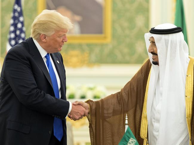 US President Donald Trump and Saudi Arabia’s King Salman bin Abdulaziz al-Saud shake hands during a signing ceremony at the Saudi Royal Court in Riyadh last May. Picture: Saudi Royal Palace/AFP