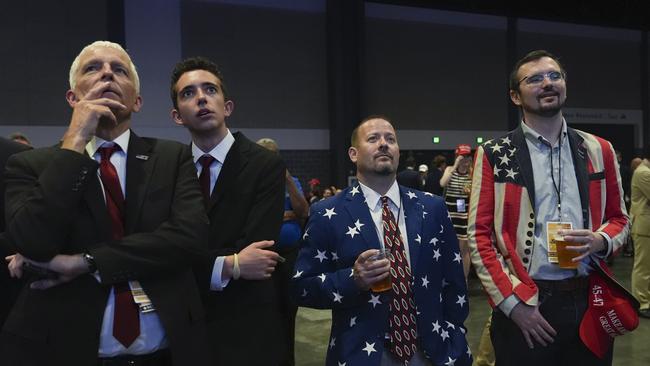 Trump supporters watch results as they attend a watch party at the Palm Beach County Convention Center in West Palm Beach, Florida.