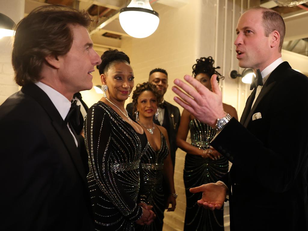 Prince William talks with Tom Cruise and music group Sister Sledge at the event. Picture: Getty Images