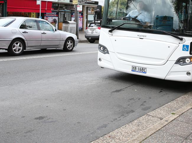 Schoolboy hit by car after getting off bus