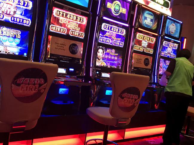 A case of COVID-19 has been traced to The Star casino in Pyrmont after a patron visited on Saturday 4th July. Health authorities are racing to contain clusters that threaten to break through containment measures. A cleaner sanitizes pokie machines. Picture: Supplied