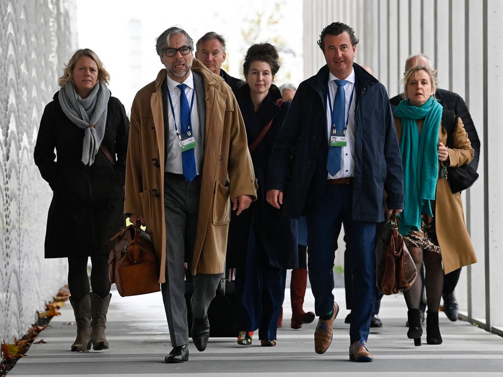 Lawyers including lawyer Peter Langstraat (second left) arrive at the Schiphol Judicial complex prior to the verdict. Picture: AFP