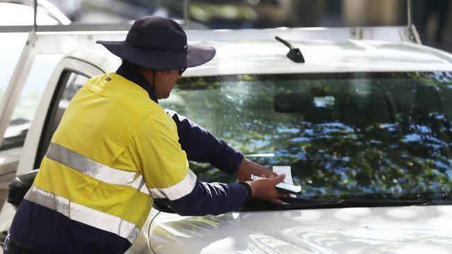 Parents can expect parking inspectors to be out in full force across Brisbane. Picture: Annette Dew