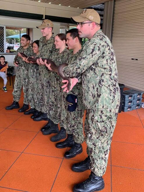 Snakes alive ... the sailors get a first-hand account of some of Australia’s wildlife.