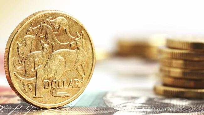 Aussie one dollar coins, on a twenty dollar note.