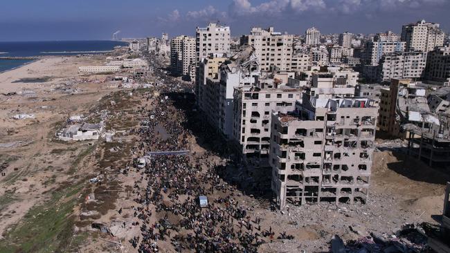 Displaced Palestinians return to their homes in the northern Gaza Strip on Monday, Jan. 27, 2025, following Israel's decision to allow thousands of them to go back for the first time since the early weeks of the 15-month war with Hamas. (AP Photo/Mohammad Abu Samra)