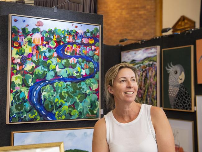 SHOW STOPPER: Toowoomba art enthusiasts are waiting with bated breath as the Grammar School prepare for the official opening of their 28th annual art show this weekend. Grammar Art Show co-ordinator Rebecca Statton with works by the feature artist, Mel Simmonds. Picture: Nev Madsen