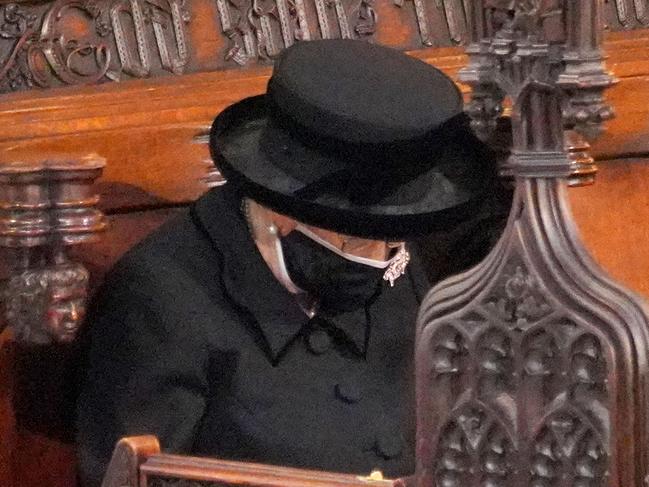 WINDSOR, ENGLAND - APRIL 17: Queen Elizabeth II bows her head during the funeral of Prince Philip, Duke of Edinburgh, at St George's Chapel at Windsor Castle on April 17, 2021 in Windsor, England. Prince Philip of Greece and Denmark was born 10 June 1921, in Greece. He served in the British Royal Navy and fought in WWII. He married the then Princess Elizabeth on 20 November 1947 and was created Duke of Edinburgh, Earl of Merioneth, and Baron Greenwich by King VI. He served as Prince Consort to Queen Elizabeth II until his death on April 9 2021, months short of his 100th birthday. His funeral takes place today at Windsor Castle with only 30 guests invited due to Coronavirus pandemic restrictions. (Photo by Jonathan Brady - WPA Pool/Getty Images)