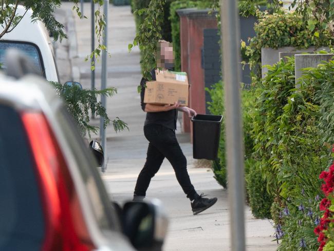 People arrive at Burbank’s house. Picture: Tony Gough