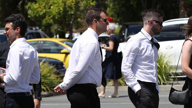 Many mourners made the effort to wear formal attire, as requested. Picture: NIGEL HALLETT