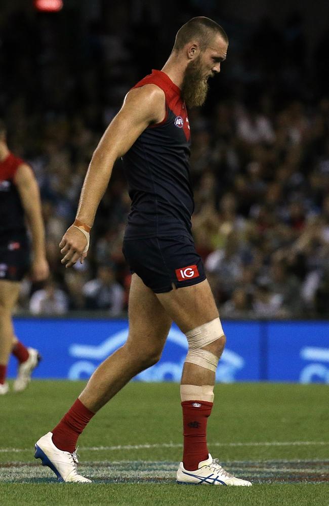 Max Gawn hobbles off the ground. Picture: Wayne Ludbey