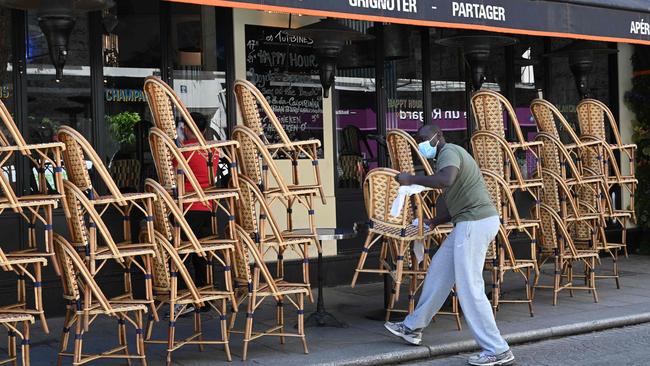 A barman prepares the terrace of a restaurant in Paris over the weekend. Picture: AFP