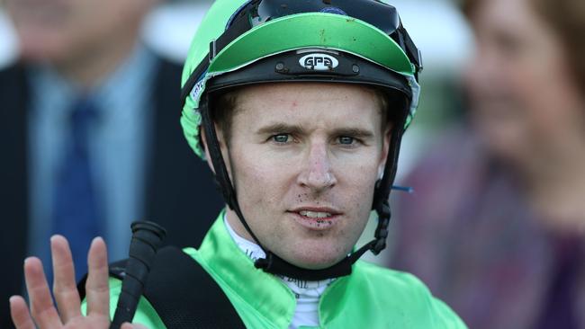 Tommy Berry returns on Idance after winning race The Mick "Crusher" Kerr Memorial Handicap.