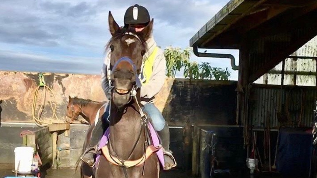Verry Elleegant as a young filly with trackwork rider Ceilidh Johnston.