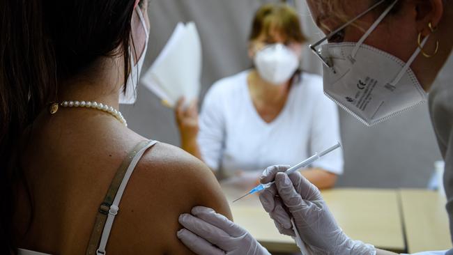 A doctor administers the Pfizer/BioNTech vaccine at a mobile centre in Leipzig, Germany. Picture: Getty Images