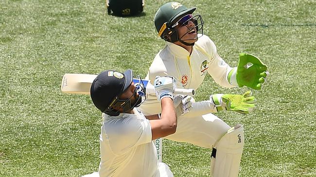 Rohit Sharma skies one off Nathan Lyon. Picture: Getty