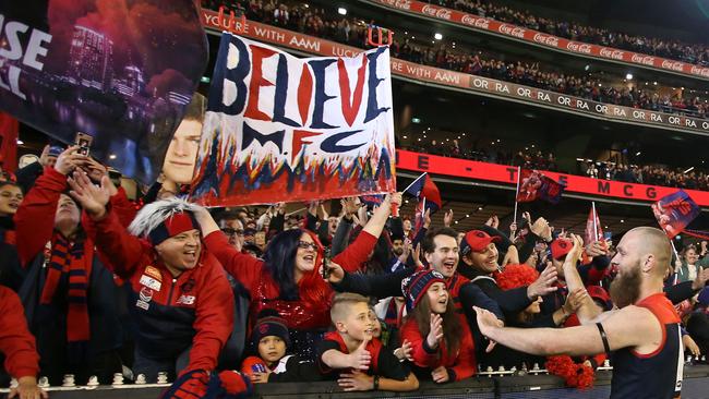 MELBOURNE, VICTORIA – SEPTEMBER 07: Demons fans in the crowd react as Max Gawn of the Demons leaves the field after winning the AFL First Elimination Final match between the Melbourne Demons and the Geelong Cats at the Melbourne Cricket Ground on September 7, 2018 in Melbourne, Australia. (Photo by Scott Barbour/AFL Media/Getty Images)