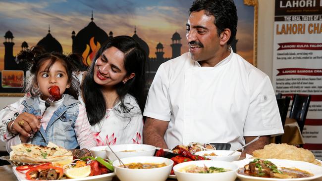 Owner and chef Rana Arshad Mehdi with his wife Faiza Noshi and their daughter Asna Mehdi, 3, with some of the Lahori dishes from their Pakistani restaurant, Lahori Dhaba in Punchbowl. Picture: Jonathan Ng