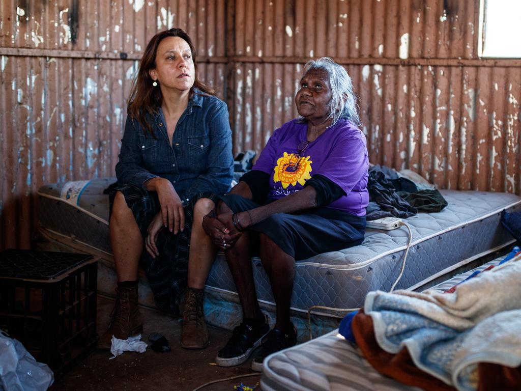 Indigenous filmmaker and Yes campaigner Rachel Perkins, left, with Aunty Felicity Hayes in one of the dirt-poor camps outside Alice Springs. Picture: Matt Turner