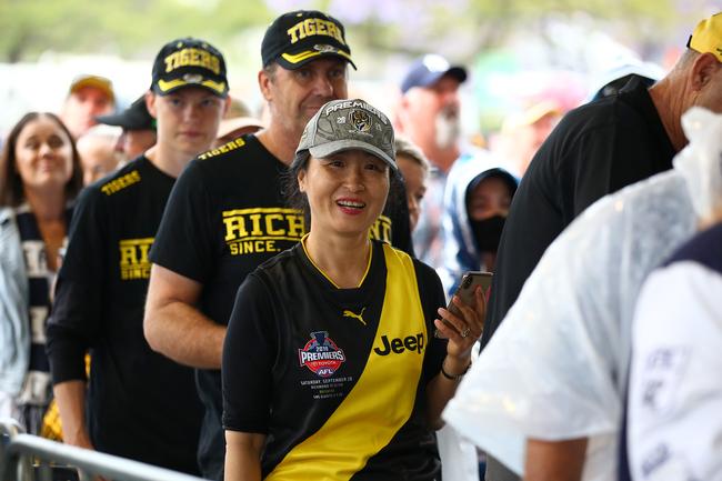 BRISBANE, AUSTRALIA - OCTOBER 24: Richmond fans arrive to the gate before the 2020 AFL Grand Final match between the Richmond Tigers and the Geelong Cats at The Gabba on October 24, 2020 in Brisbane, Australia. (Photo by Jono Searle/AFL Photos/via Getty Images)