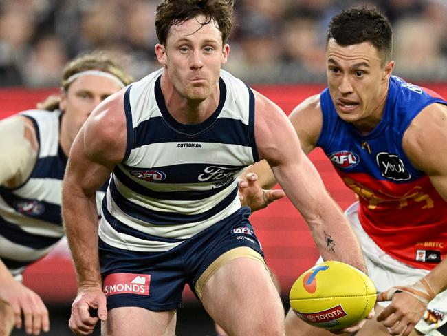 MELBOURNE, AUSTRALIA - SEPTEMBER 21: Jed Bews of the Cats competes for the ball during the AFL Preliminary Final match between Geelong Cats and Brisbane Lions at Melbourne Cricket Ground, on September 21, 2024, in Melbourne, Australia. (Photo by Quinn Rooney/Getty Images)