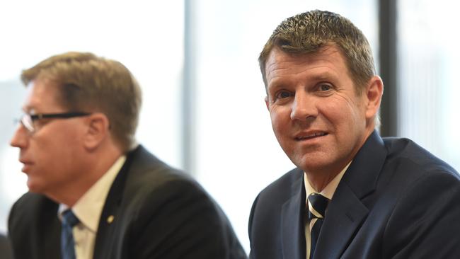 NSW Premier Mike Baird (right) and Deputy Premier Troy Grant (left) meet with members of the greyhound industry in Sydney last Thursday. Picture: AAP Image/Dean Lewins