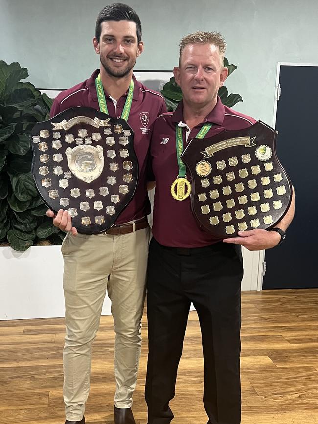 Toowoomba's Aidan Watterson and Anthony Clark with the Australian Country Cricket Championships trophies after winning the men's and women's competitions for Queensland.