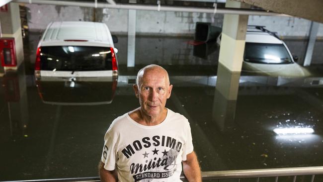 Commercial Building manager Steve Harris in front of the carpark which was flooded this morning due to wild weather that hit Byron Bay. Picture: Natalie Grono