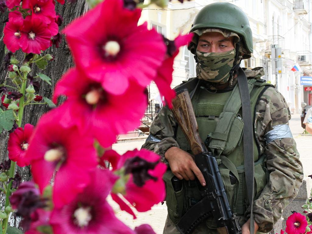 A member of Wagner group stands guard in a street in the city of Rostov-on-Don, on June 24. Picture: STRINGER / AFP