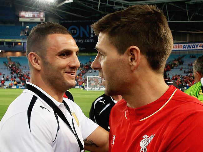 Steven Gerrard hugs Robbie Farah  after  the Liverpool Legends v Aussie Legends football game at ANZ Stadium, Homebush. pic Mark Evans